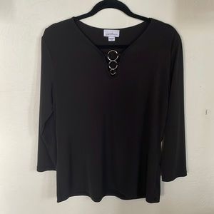 Black sleek top with silver ring details.  Excellent condition/Never worn.